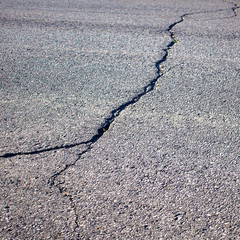 Hairline Crack In Asphalt Road